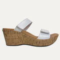White wedge sandal with cork wedge sole on a white background