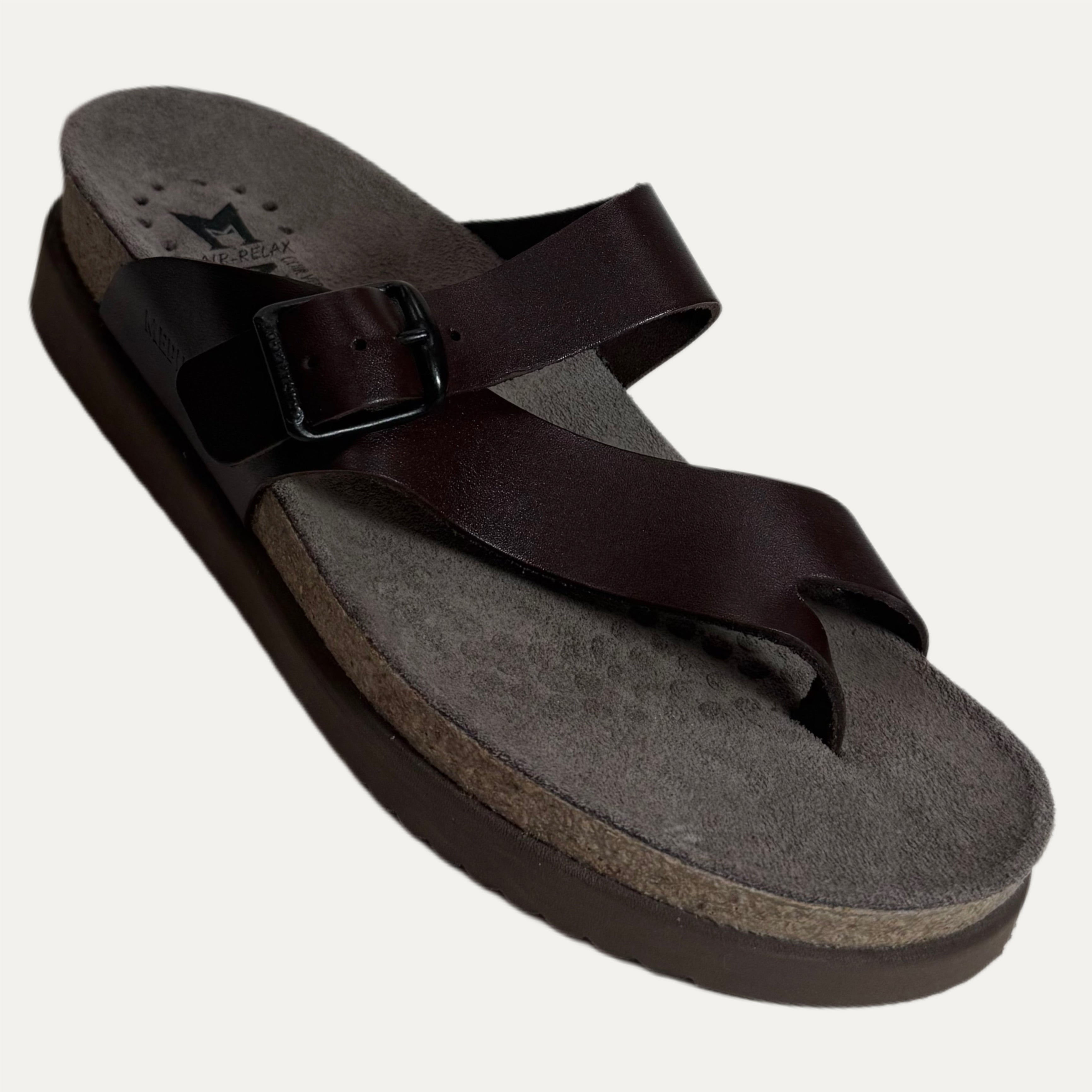 Brown sandal with a cork sole on a white background