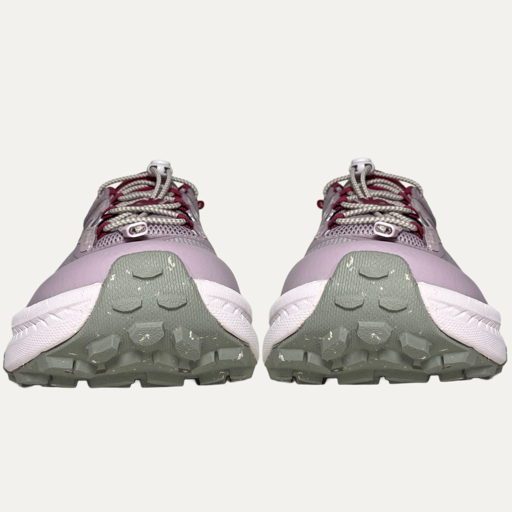 front of Lilac, red and pink athletic HOKA Transport shoe on white background