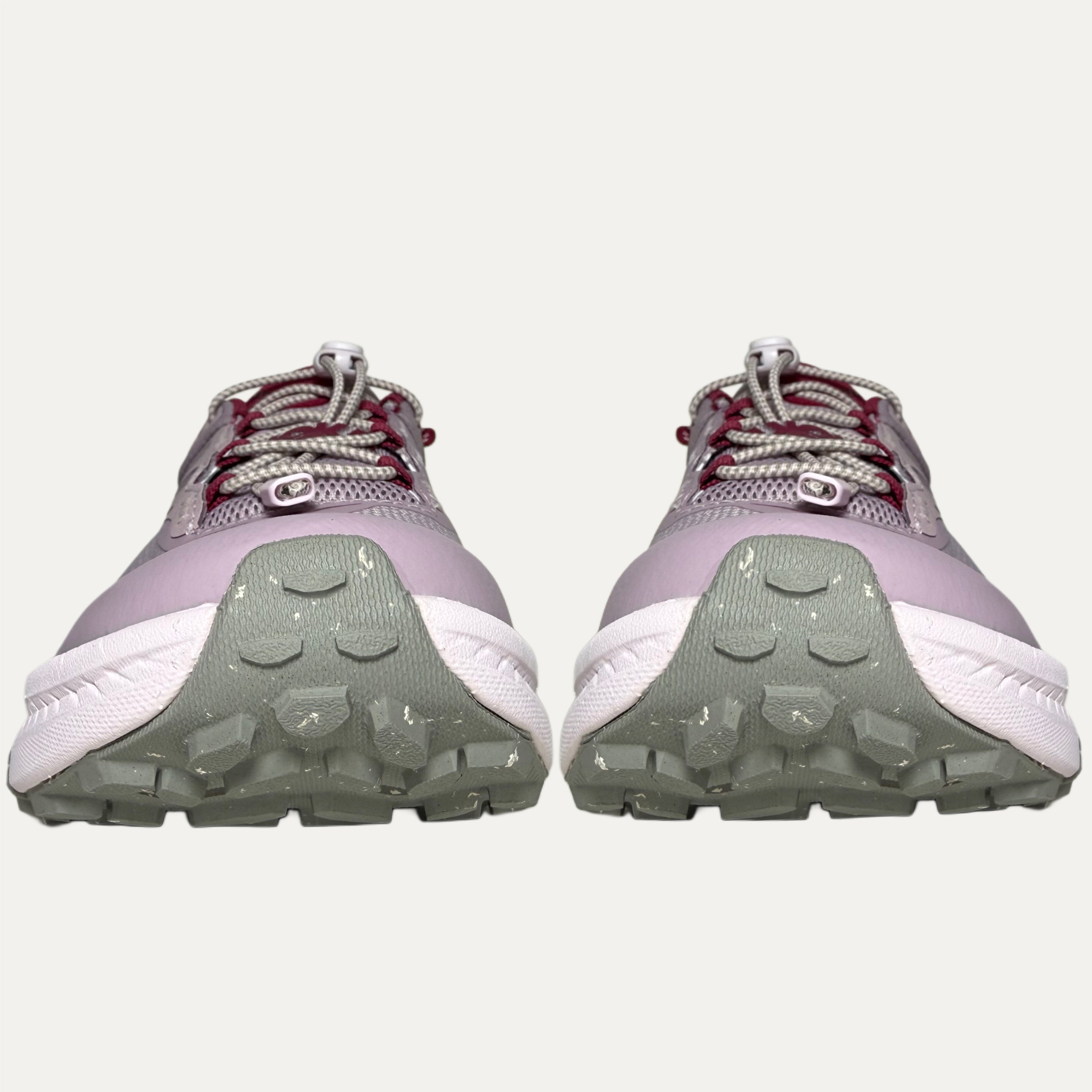 front of Lilac, red and pink athletic HOKA Transport shoe on white background