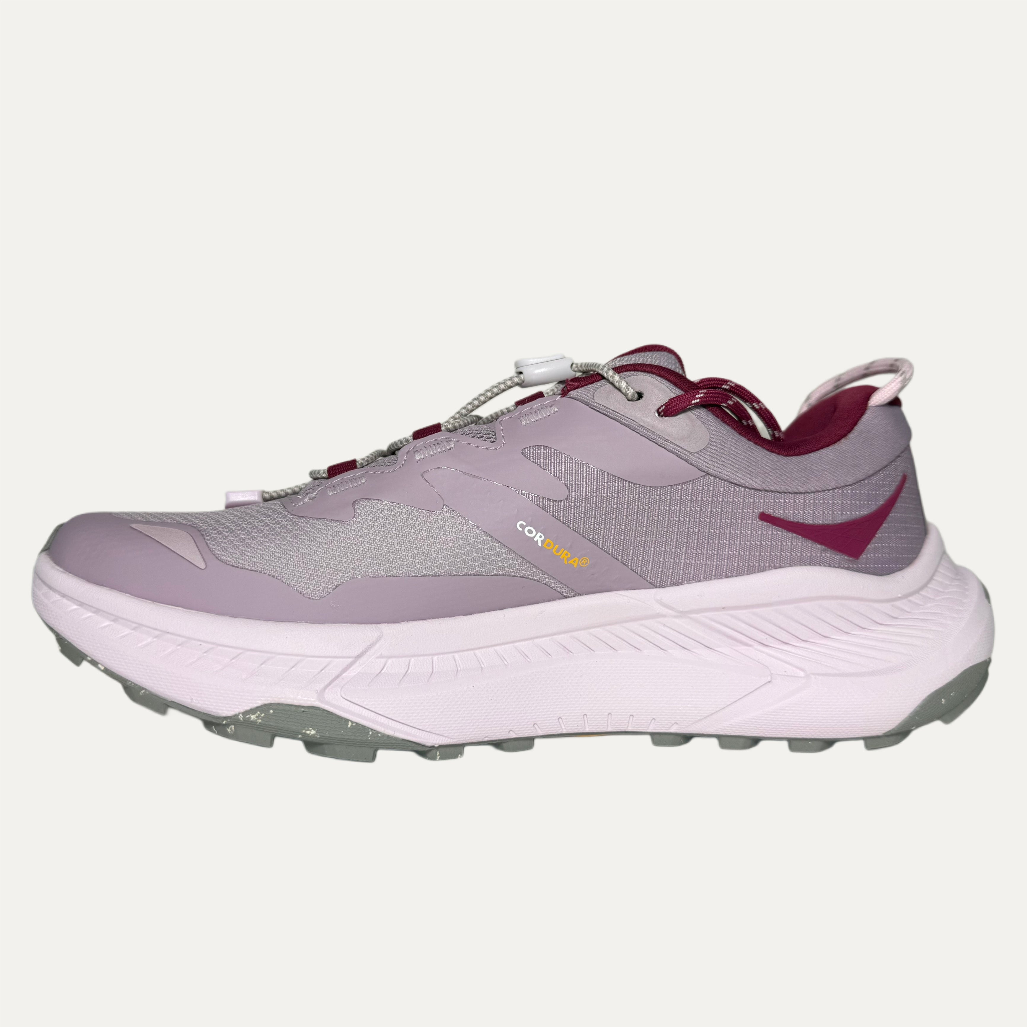 Lilac, red and pink athletic HOKA Transport shoe on white background