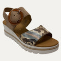 Beige sandal with snake print and brown buckle on a white background