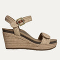 Beige wedge sandal with jute strap on a white background