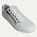 White sneaker with a zipper on a white background