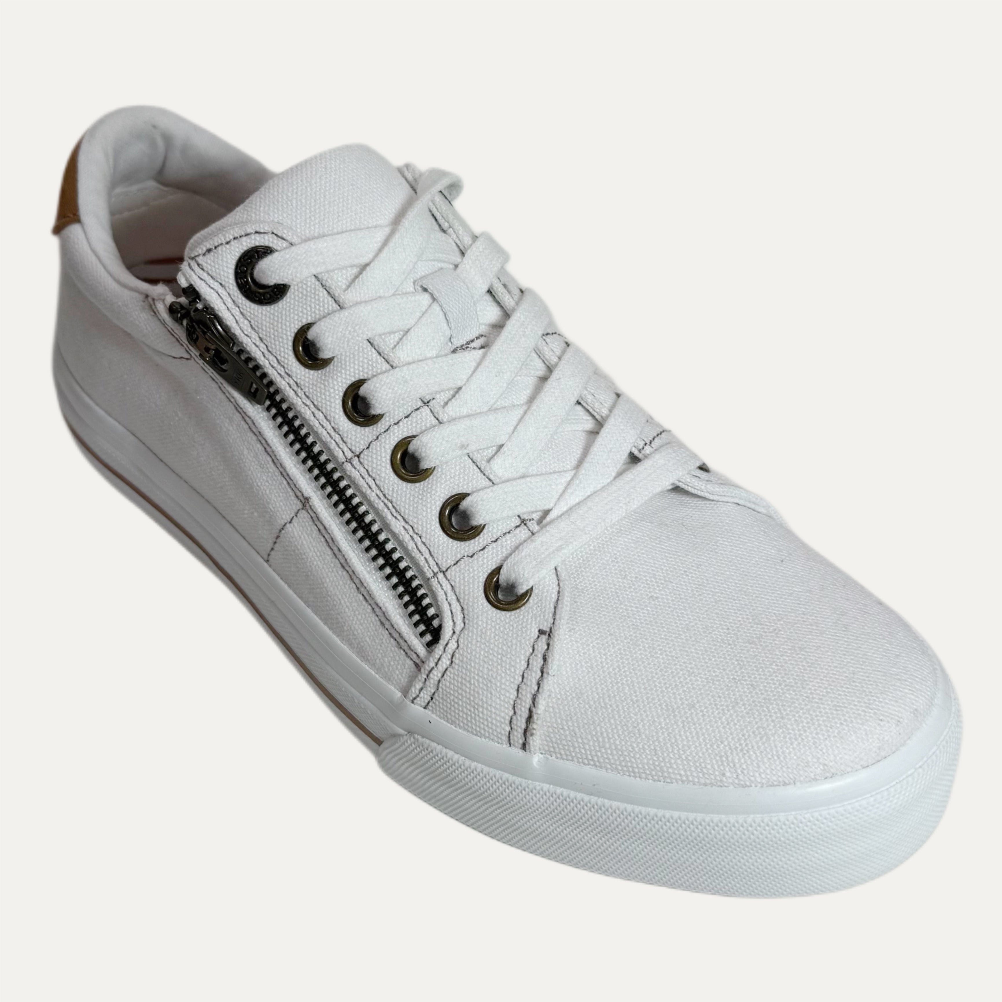 White sneaker with a zipper on a white background
