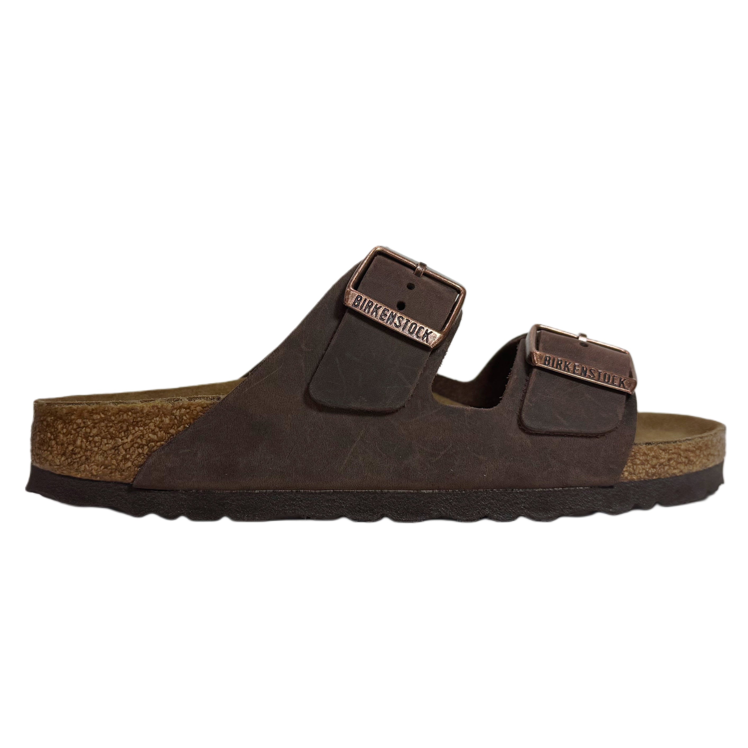 Brown sandal with a buckle on a white background