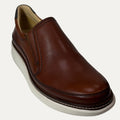 Brown leather slip-on shoe on a white background