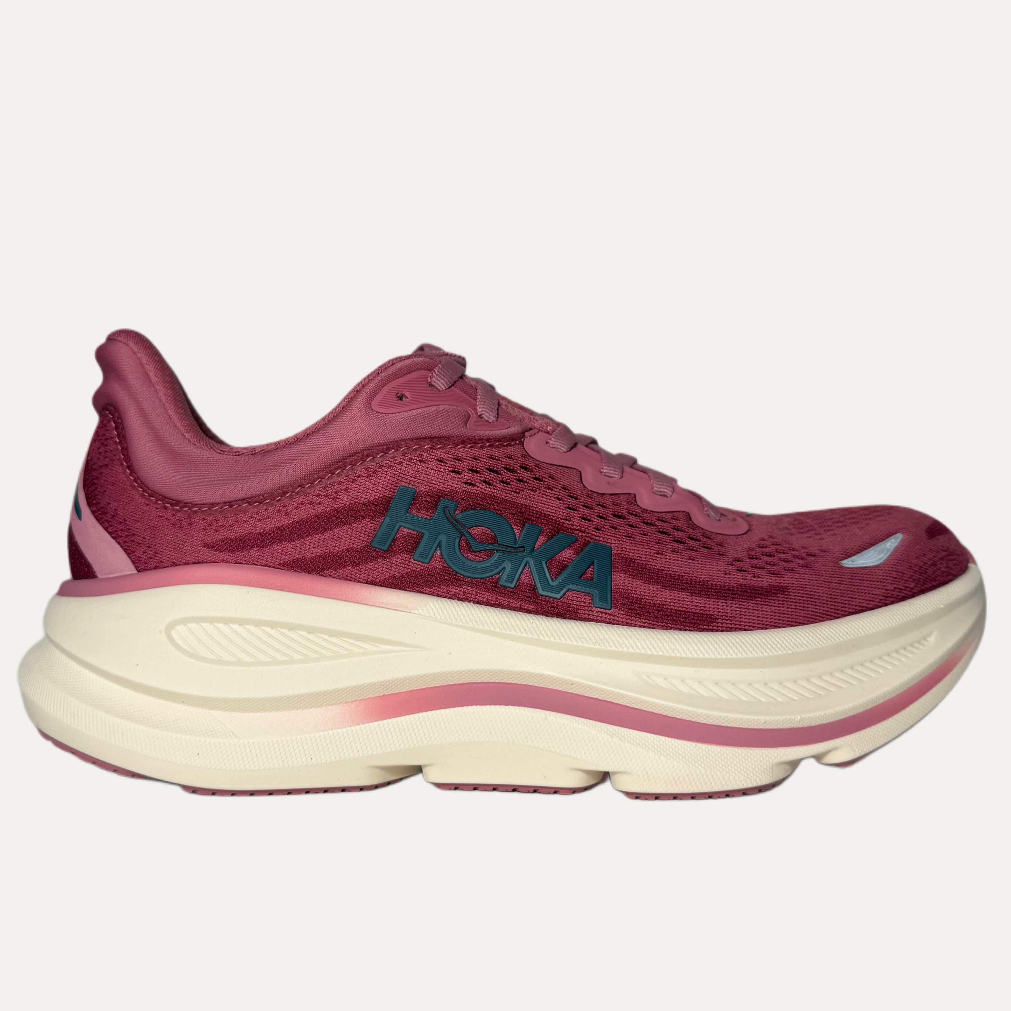 Lingonberry cranberry bondi 9 hoka running shoe on white background 
