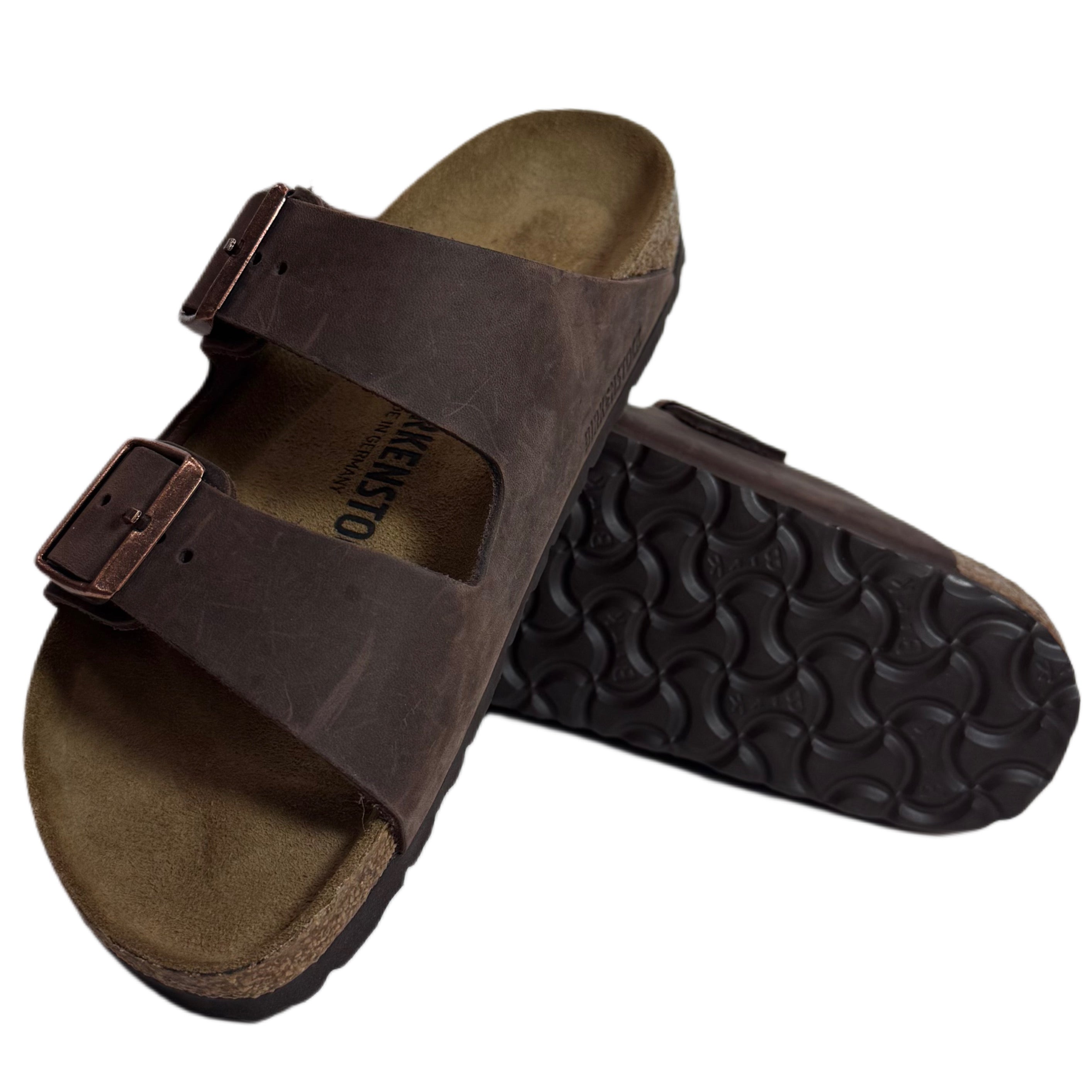 Brown sandal with a buckle on a white background