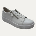 White sneaker with a zipper on a white background