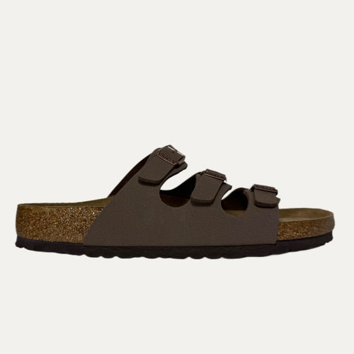 Brown sandal with a cork sole on a white background