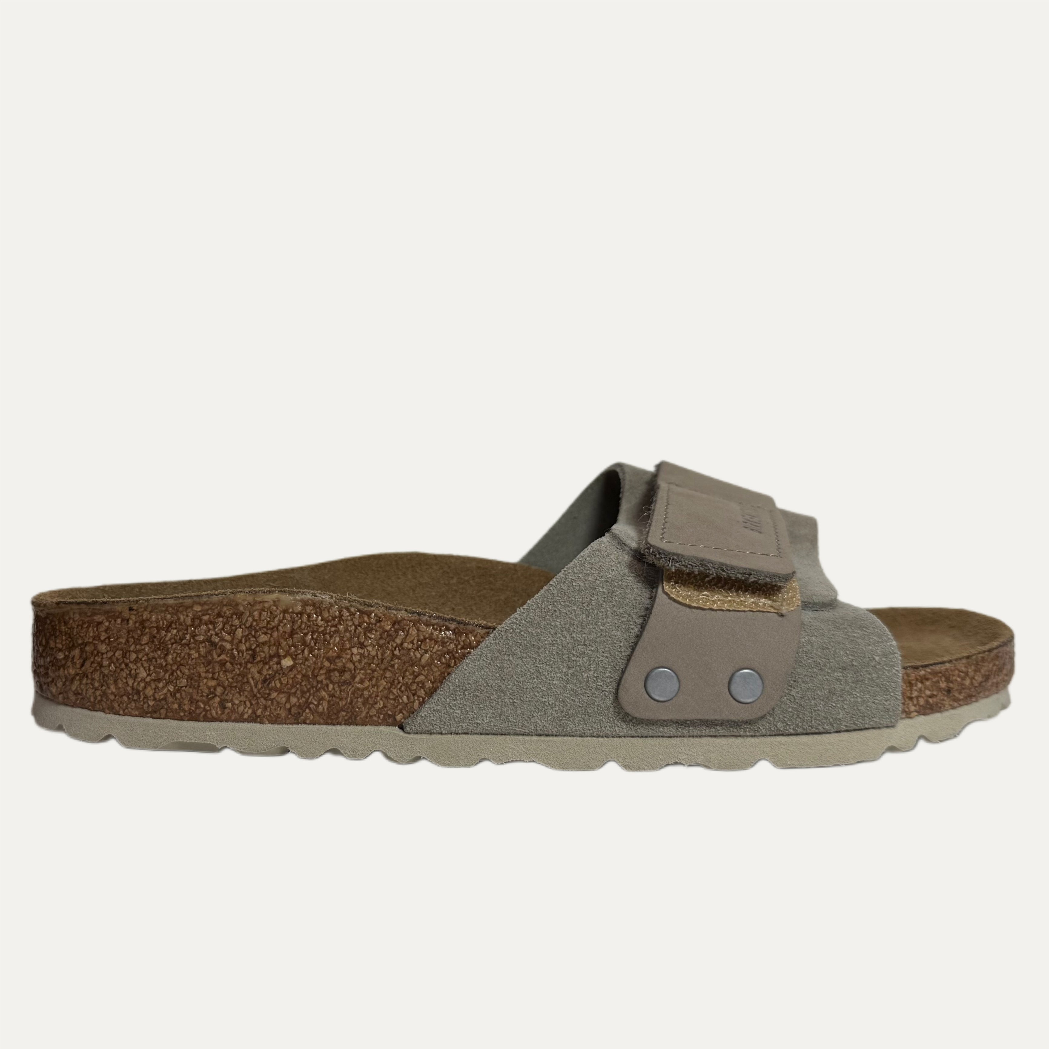 Gray sandal with a strap on a white background