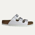 White sandal with cork sole on a white background