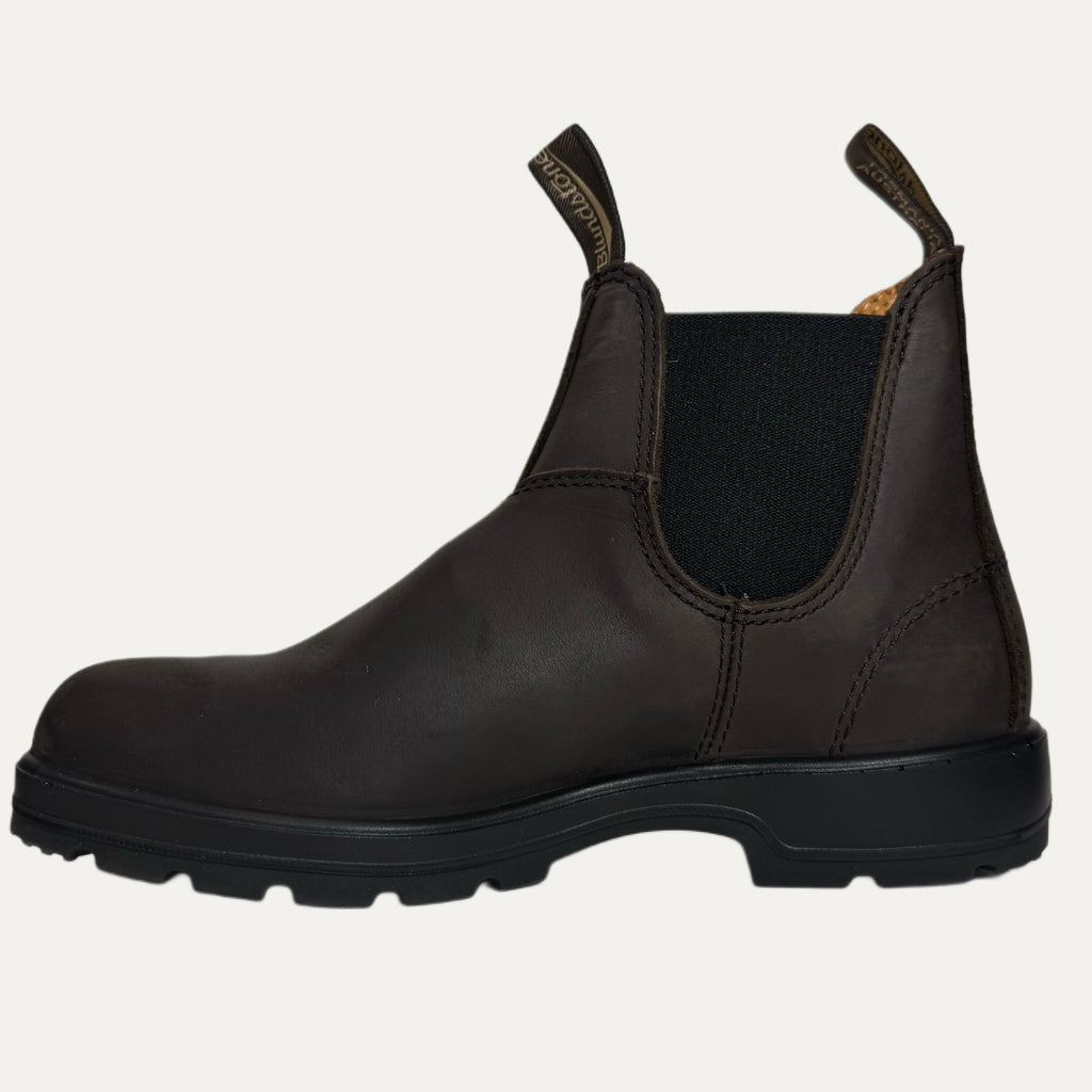 Brown leather boot with black sole on a white background