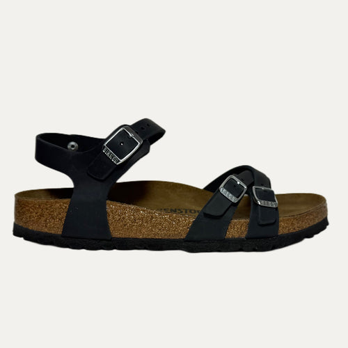 Black sandal with cork sole on a white background