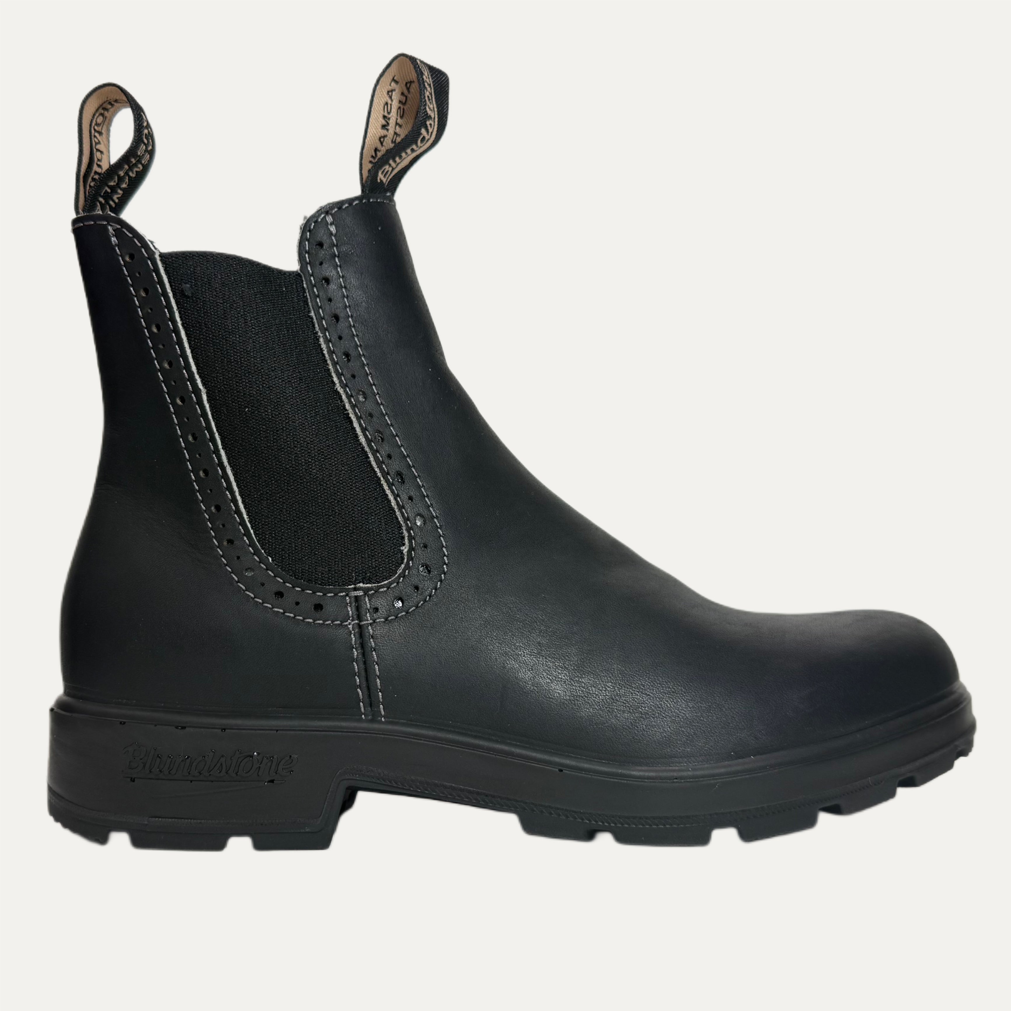 Black leather chelsea boot with a white background