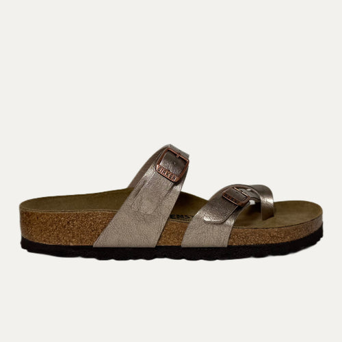 Brown sandal with cork sole on a white background