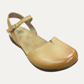 Tan sandal with a strap on a white background