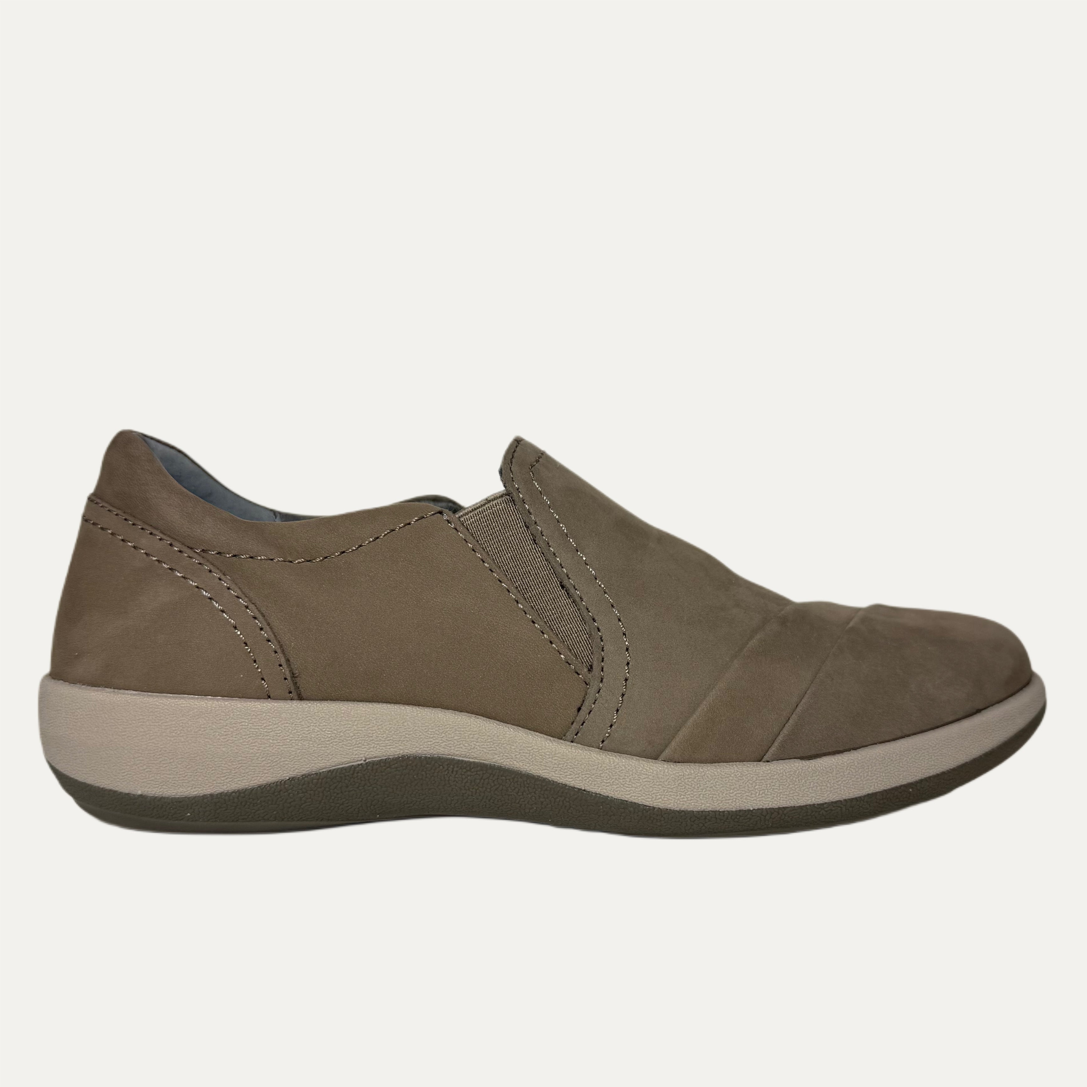 Brown slip-on shoe on a white background