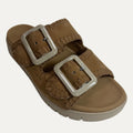 Brown sandal with tan buckles on a white background