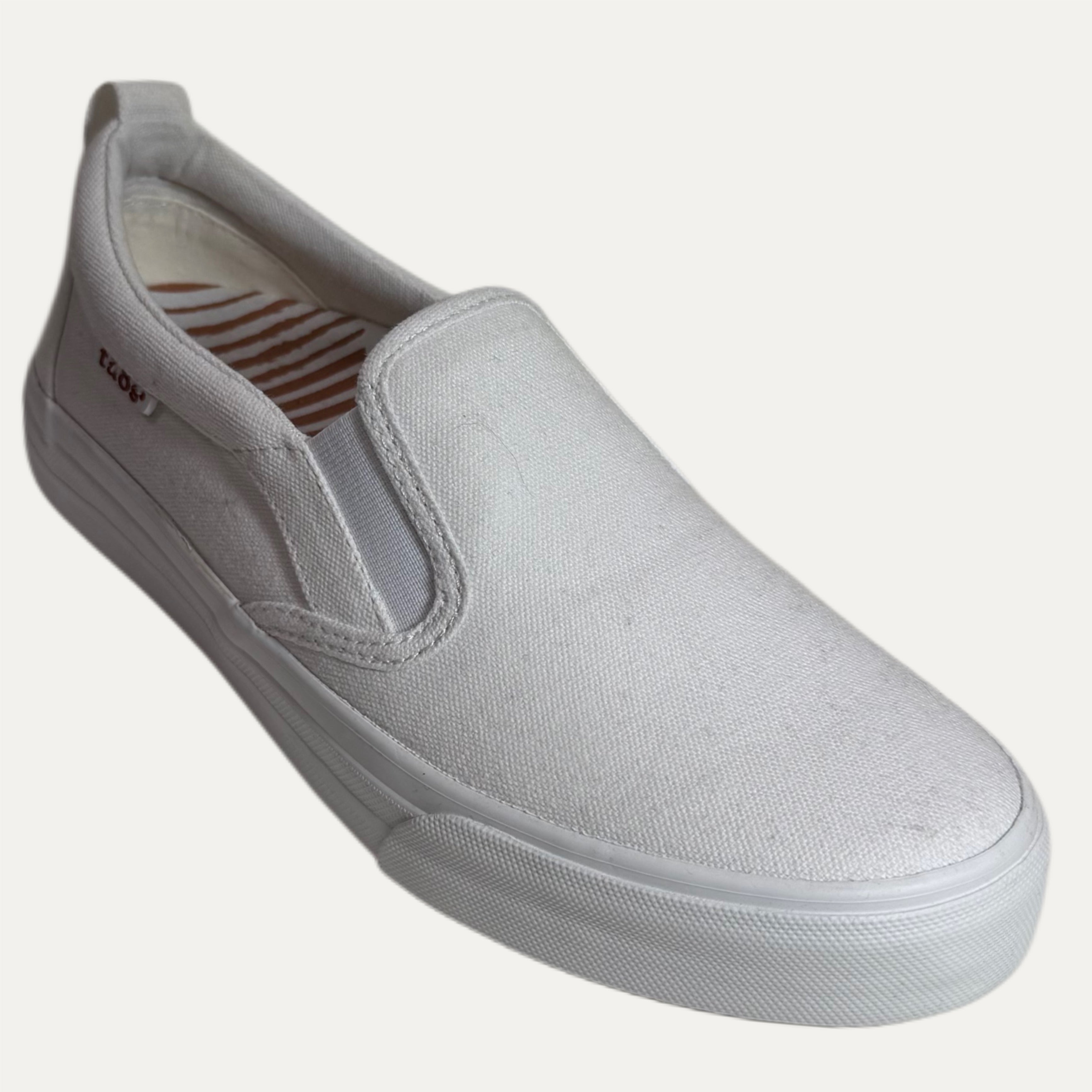 white slip-on sneaker on a white background