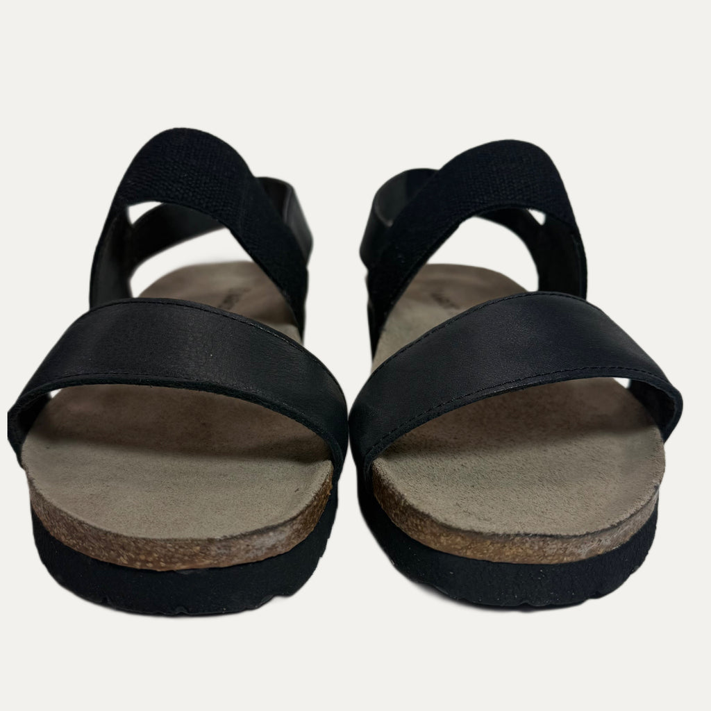 Black sandals with cork sole on a white background