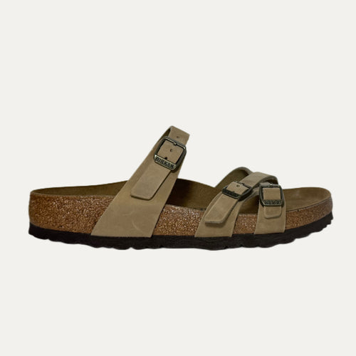 Brown sandal with cork sole on a white background