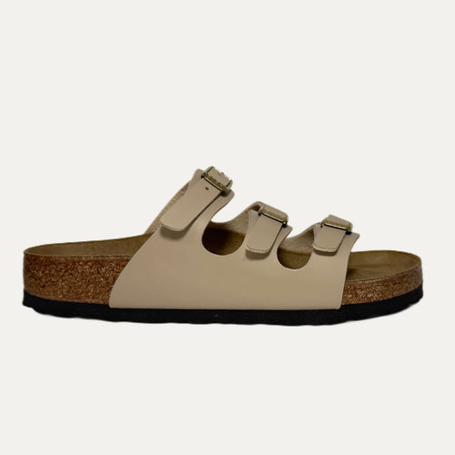 Beige sandal with cork sole on a white background