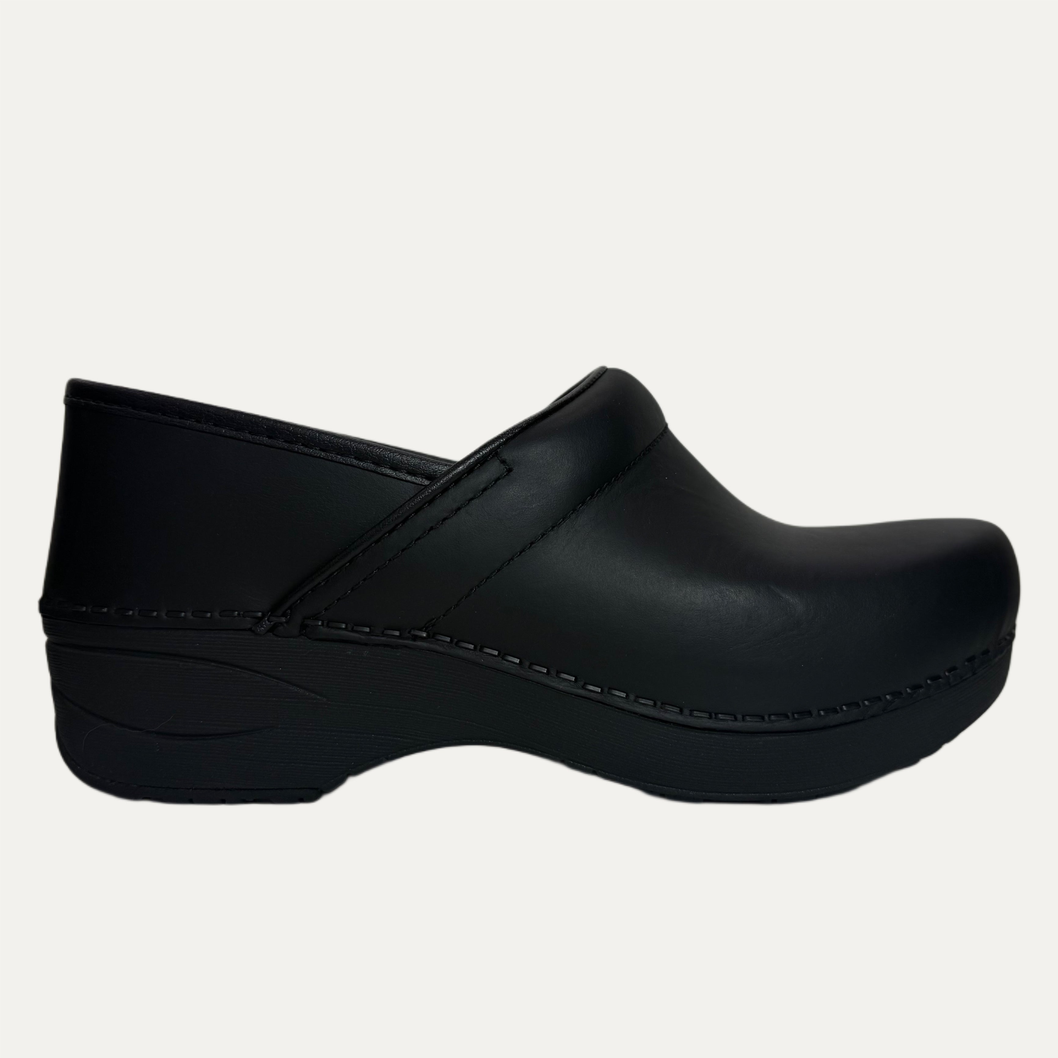 Black clog shoe on a white background