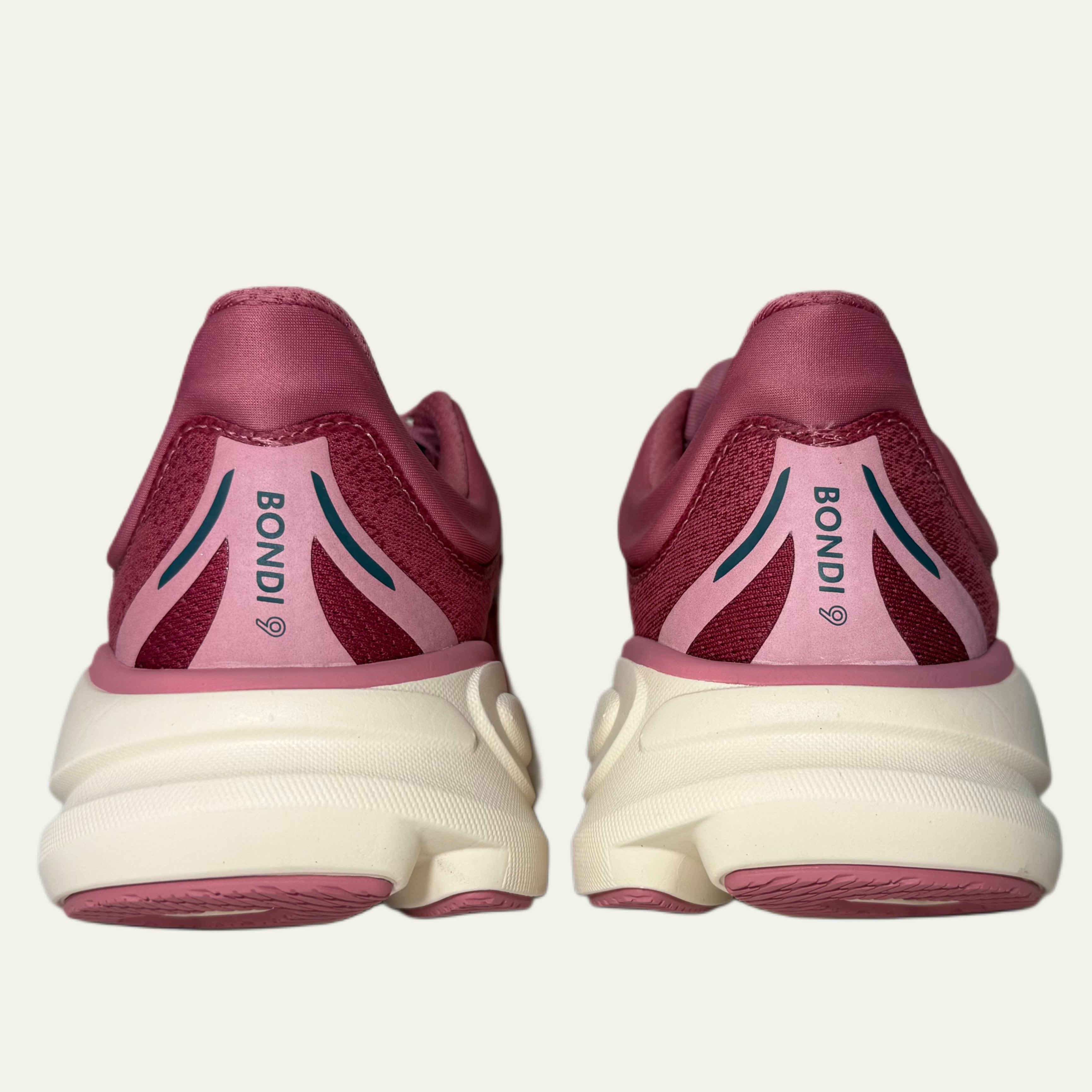 Lingonberry cranberry bondi 9 hoka running shoe on white background 