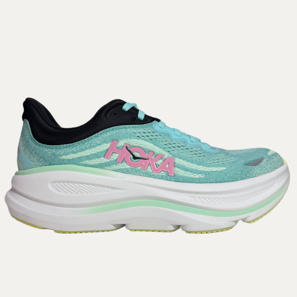 mint green running shoe with pink 'Hoka' logo on a white background