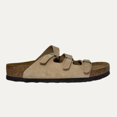 Beige sandal with cork sole on a white background
