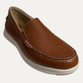 Brown leather loafer shoe on a white background