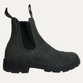 Black Chelsea boot on a light gray background