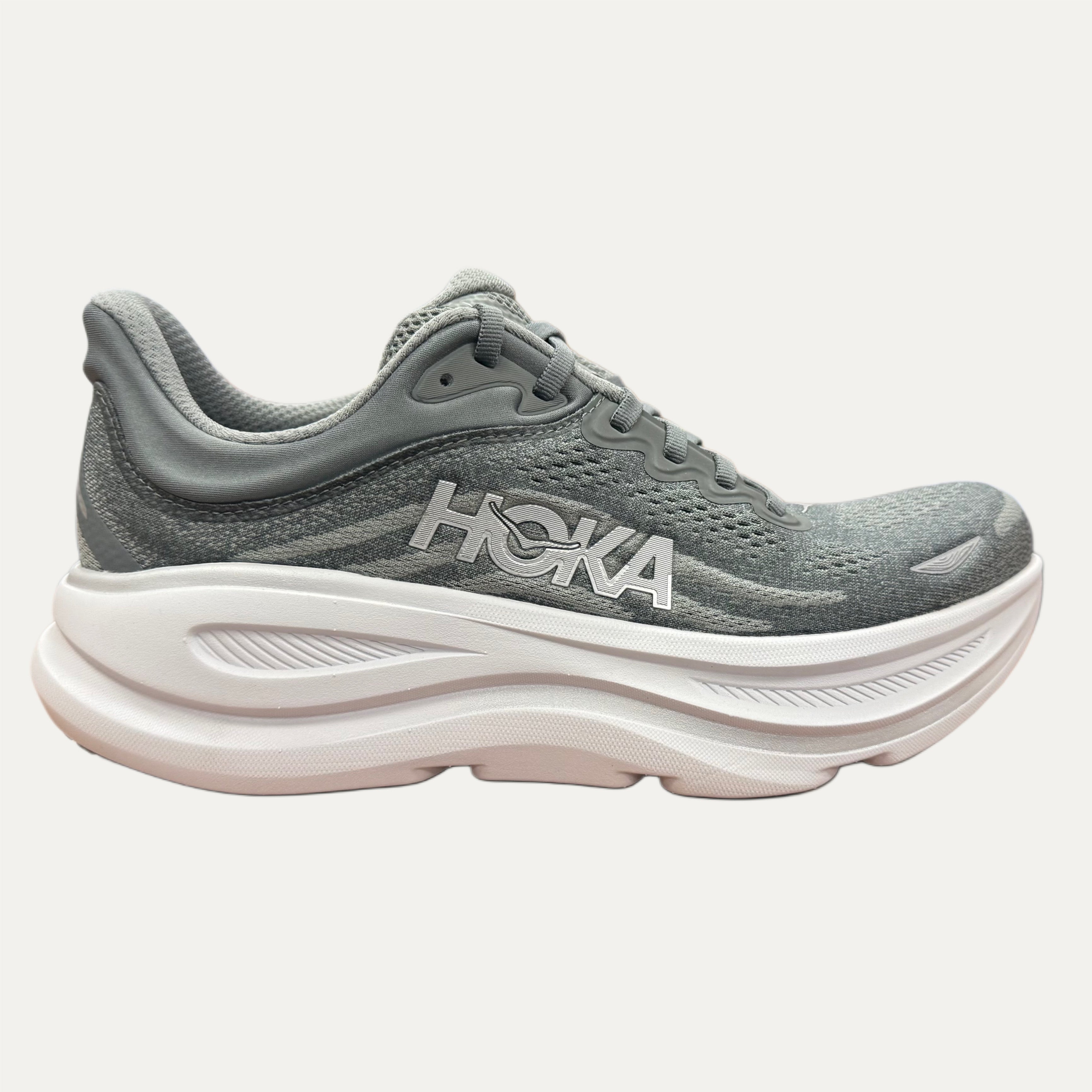 Gray sneaker with white sole on a white background