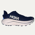 Navy running shoe with white sole on a white background