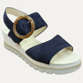 Navy blue sandal with a tortoise buckle on a white background