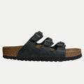 Black sandal with cork sole on a white background