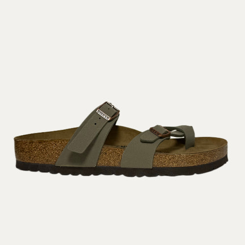 Green sandal with cork sole on a white background