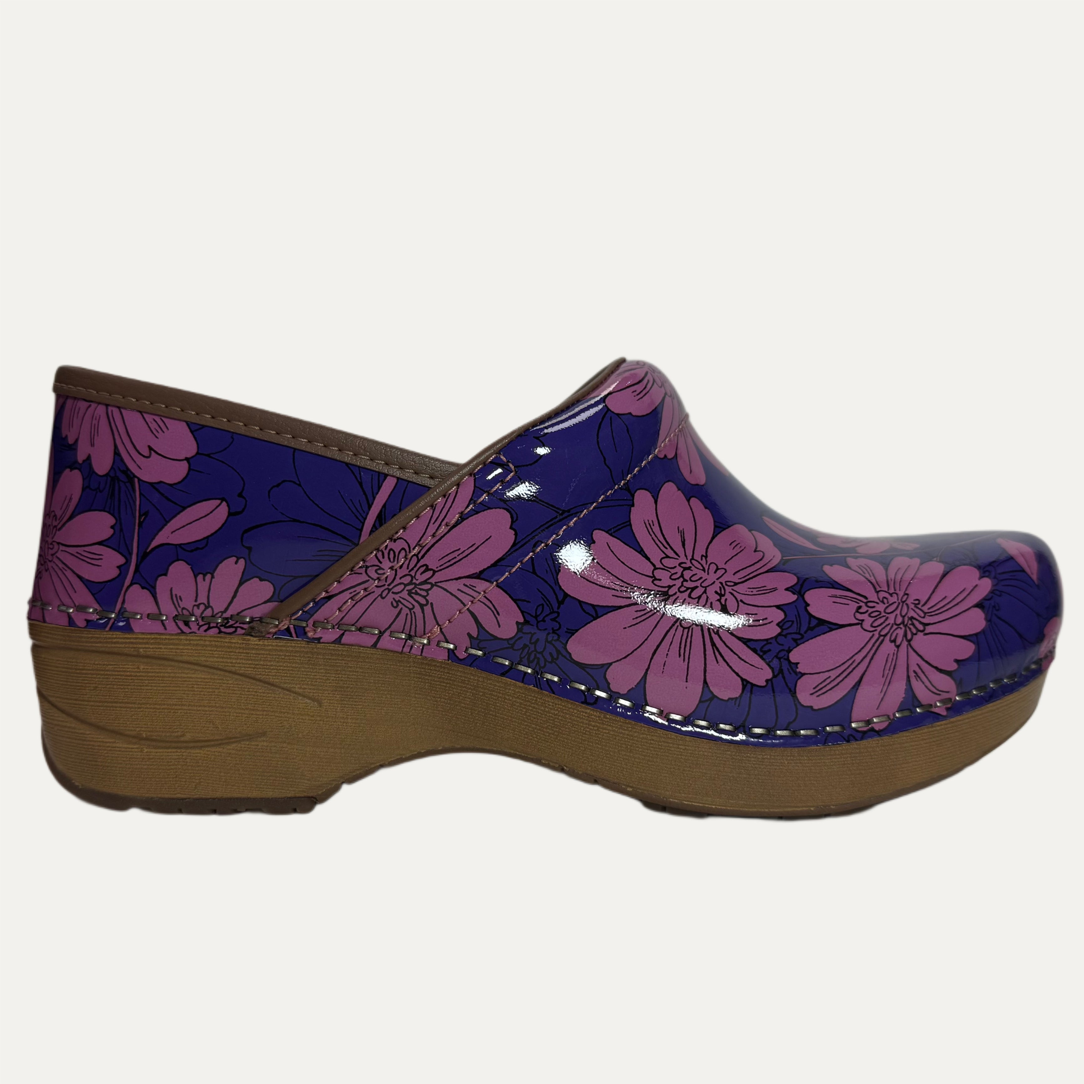 Clog shoe with purple and pink floral design on a white background