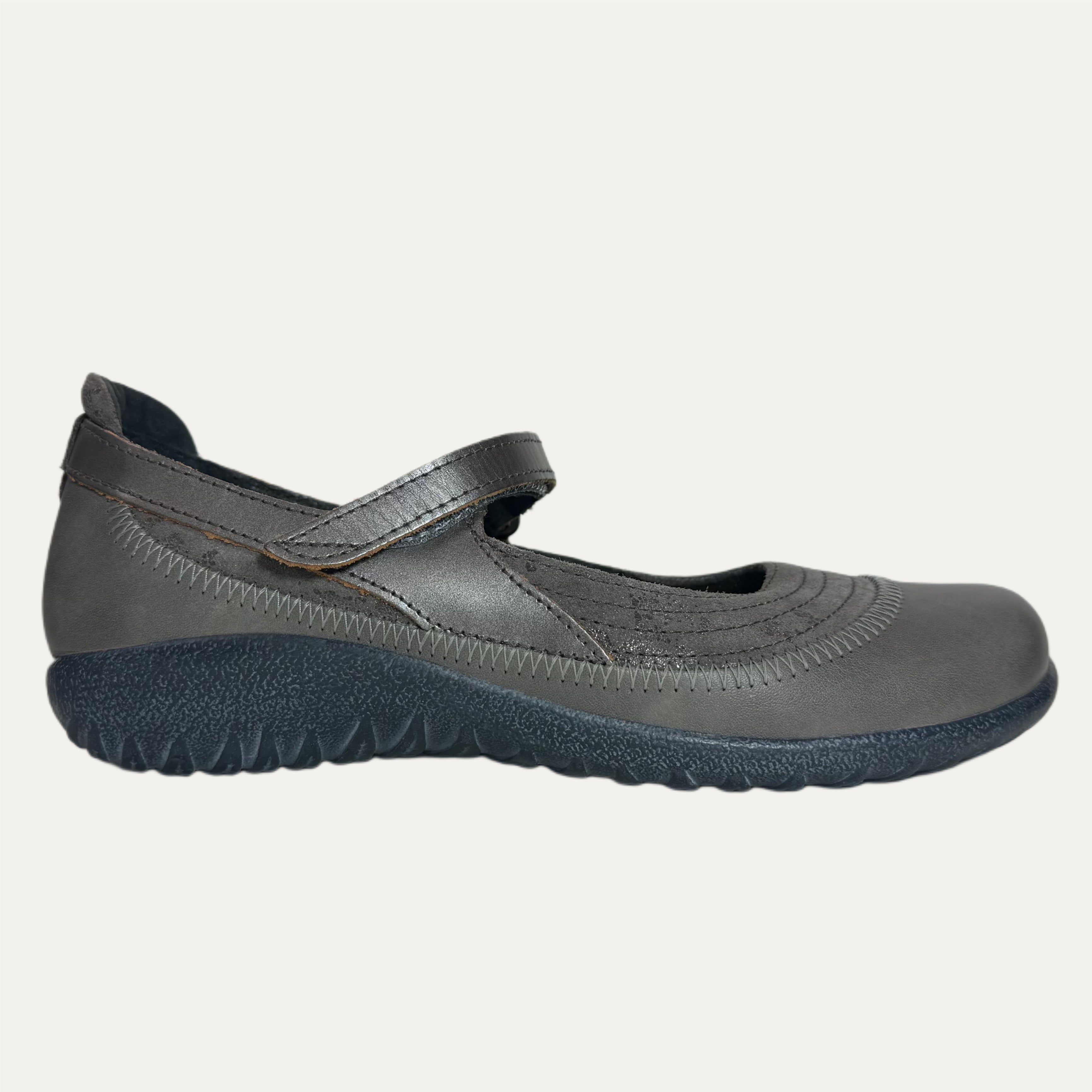 Gray shoe with a strap on a white background