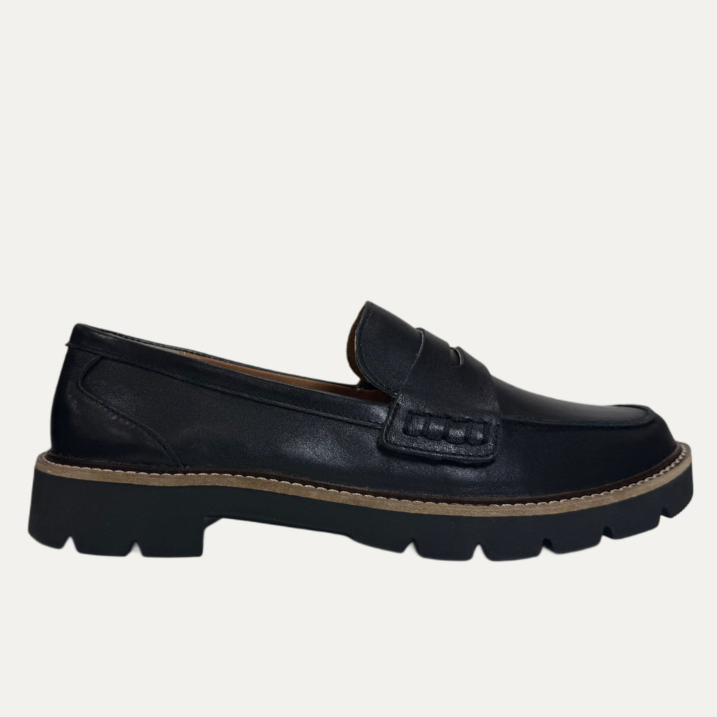 Black loafer shoe on a white background