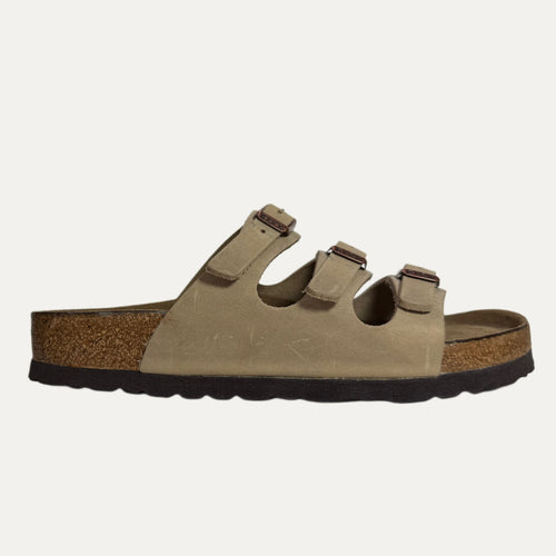 Brown sandal with cork sole on a white background