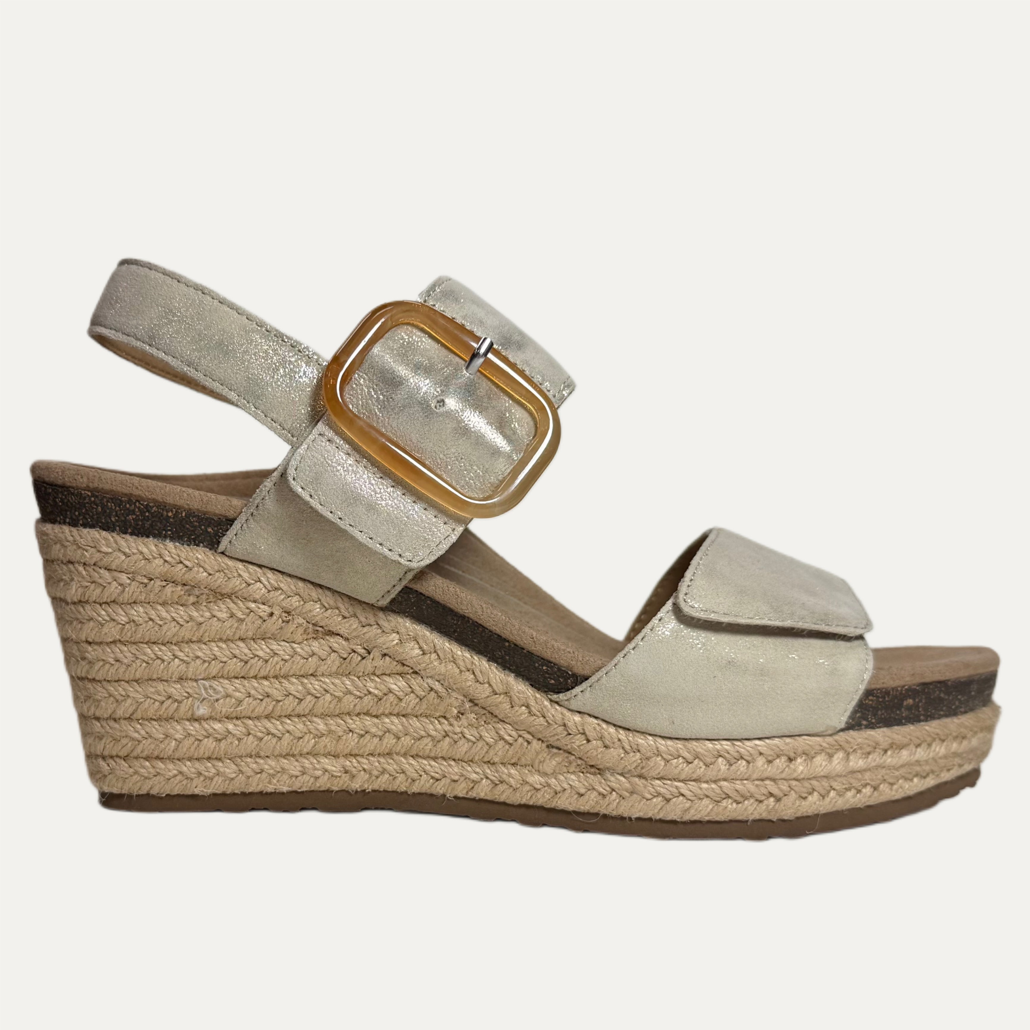Beige champagne wedge sandal with a brown buckle on a white background