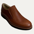 Brown leather slip-on shoe on a white background