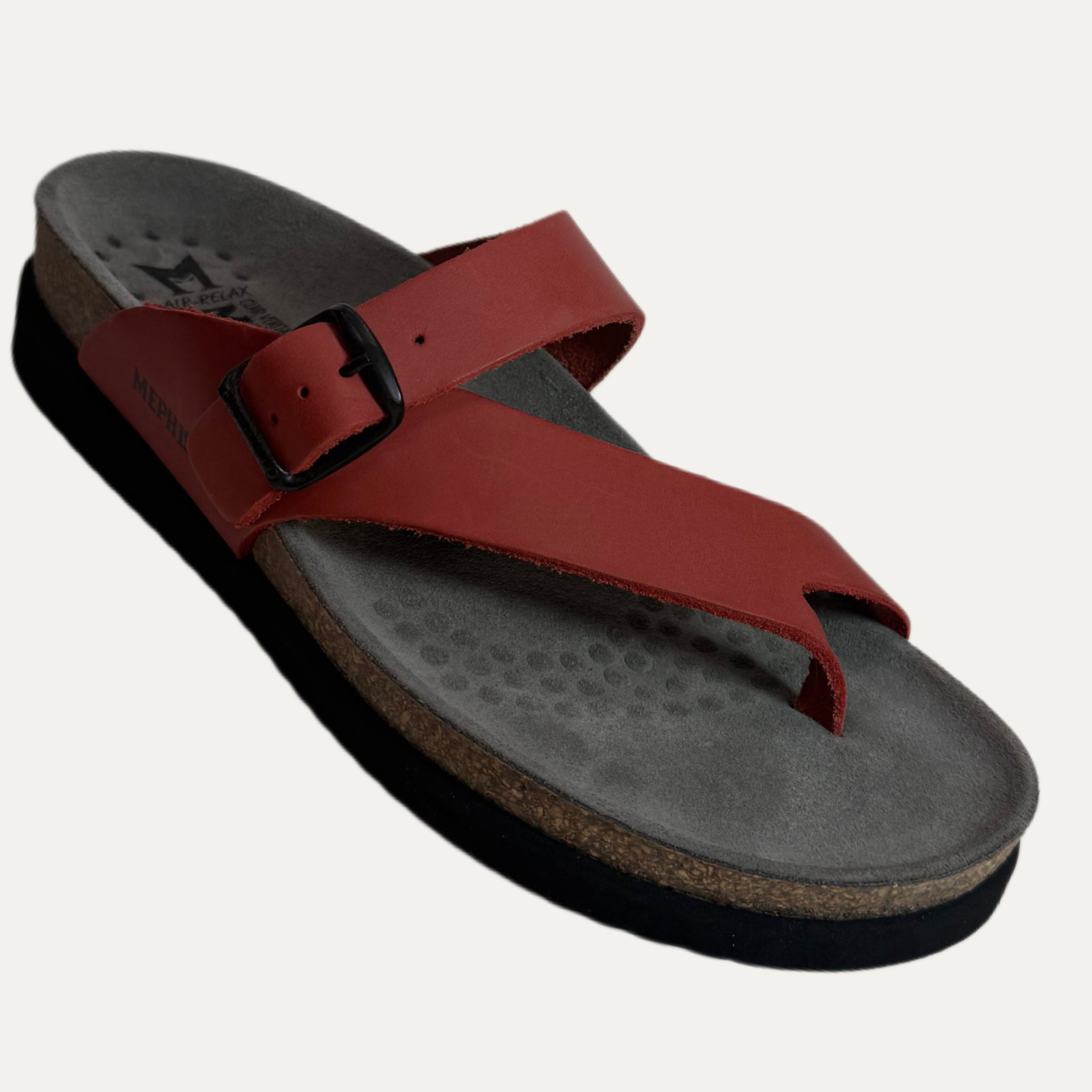 Red sandal with a cork sole on a white background