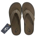 Pair of brown flip flops with a visible brand tag on a white background