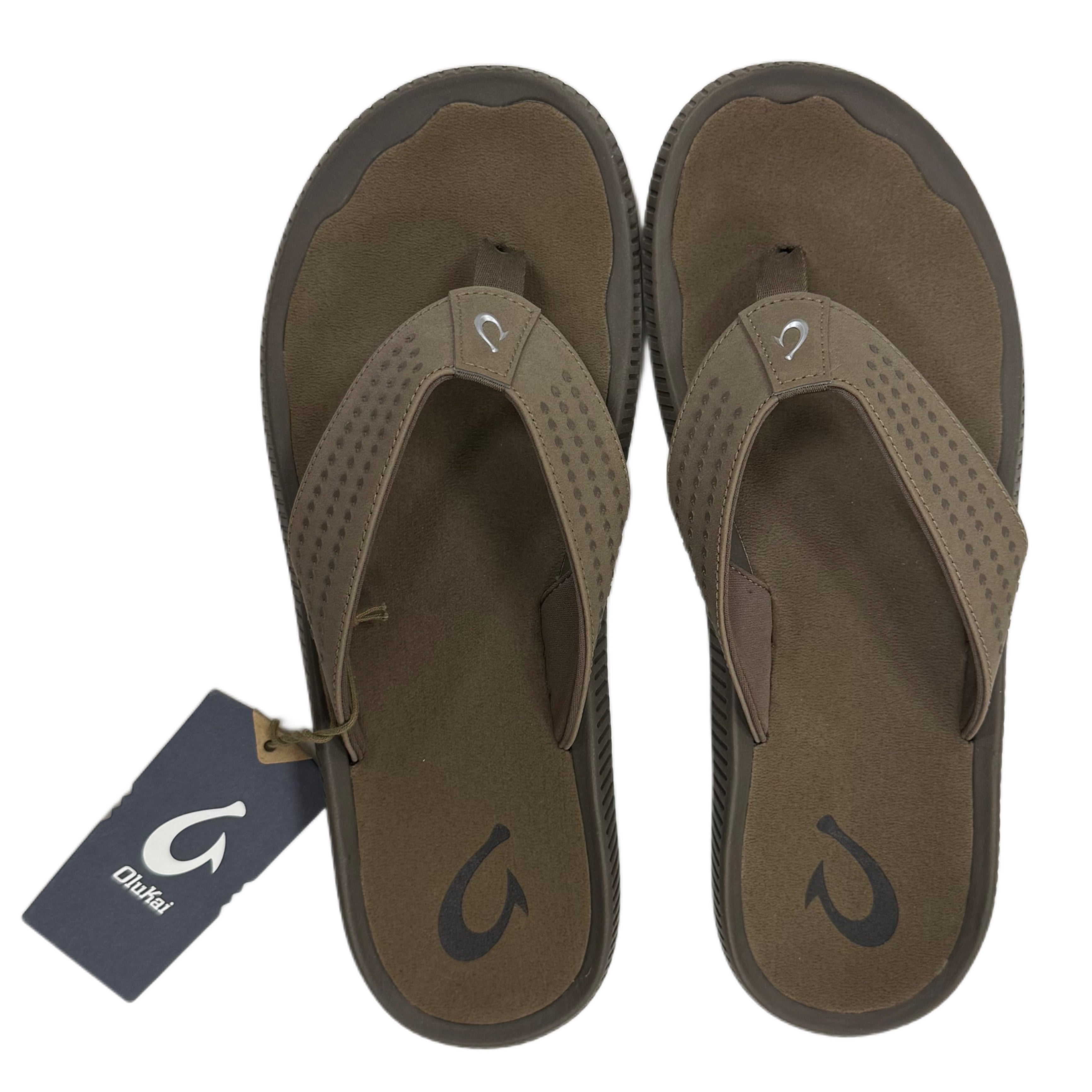 Pair of brown flip flops with a visible brand tag on a white background