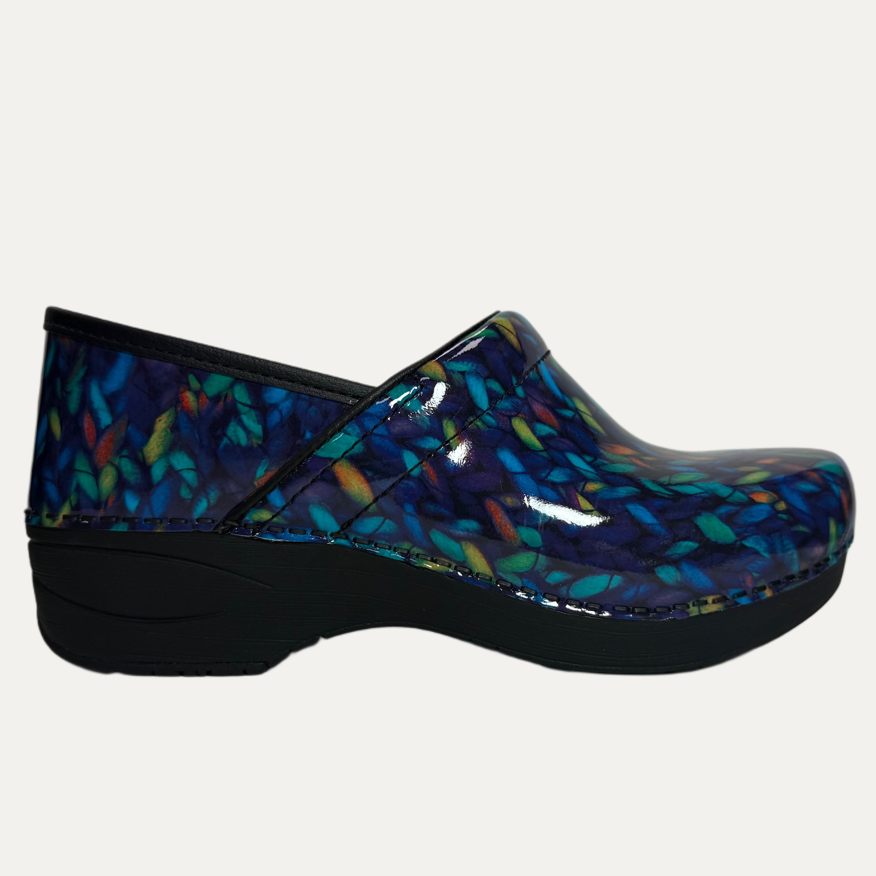 Blue clog shoe with colorful pattern on a white background