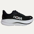 Black running shoe with white sole on a light gray background